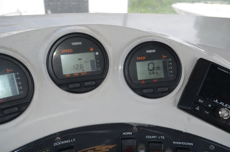 Slide: The Image of Dashboard of 2005 Glasstream 328 SCX boat showing speed and tachometer gauges. - 28