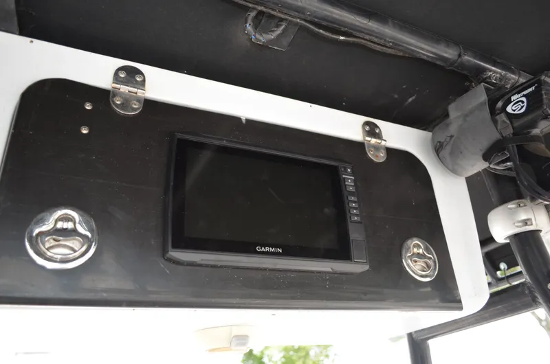 Slide: The Image of Garmin display on 2005 Glasstream 328 SCX boat dashboard with black and white panel. - 29
