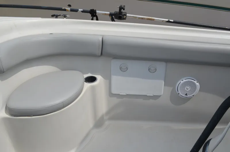 Slide: The Image of 2005 Glasstream 328 SCX boat interior with cushioned seating and speaker. - 35