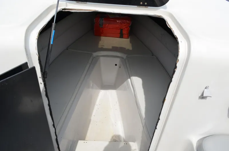 Slide: The Image of 2005 Glasstream 328 SCX boat cabin interior with storage compartment. - 38