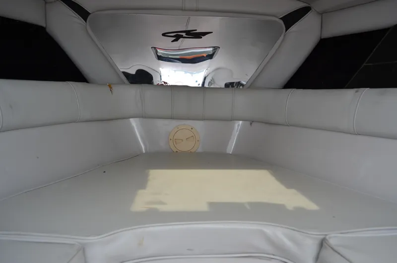 Slide: The Image of Interior of 2005 Glasstream 328 SCX boat with white cushioned seating. - 39