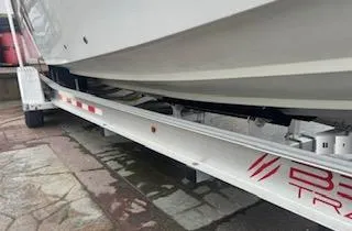 Slide: The Image of 2005 Glasstream 328 SCX boat on trailer, side view showing hull and trailer details. - 4