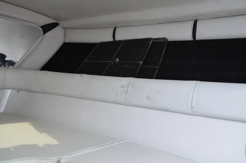 Slide: The Image of Interior of 2005 Glasstream 328 SCX boat with white seating and black accents. - 40