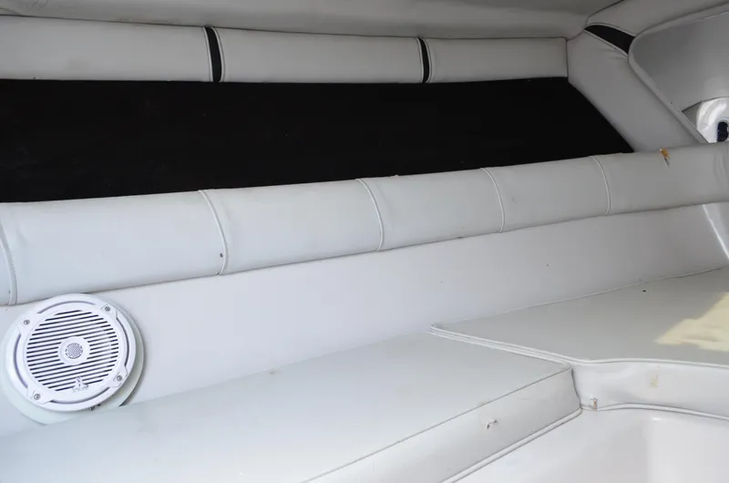 Slide: The Image of Interior of 2005 Glasstream 328 SCX boat with white seating and speaker. - 41
