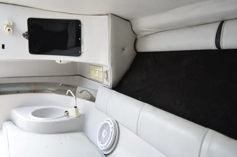 Slide: The Image of Interior of 2005 Glasstream 328 SCX boat with sink and seating area. - 43