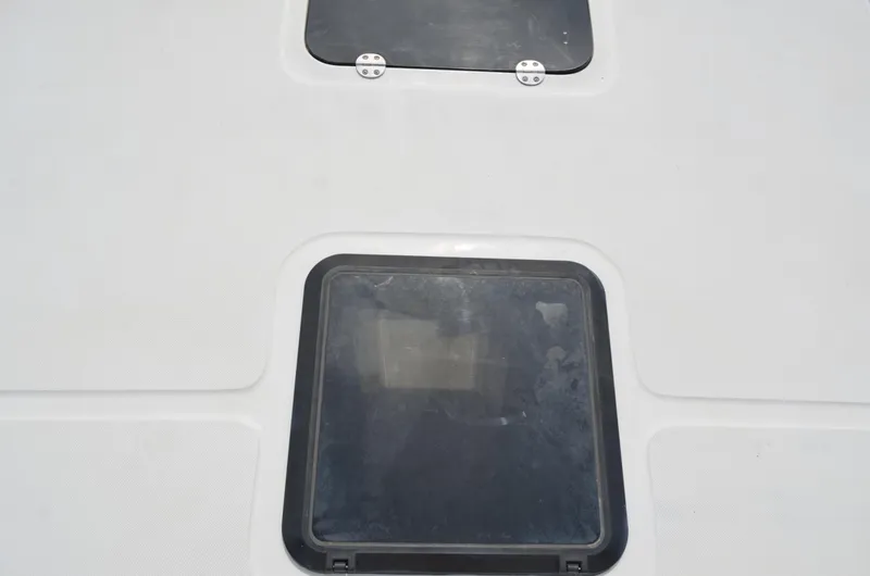 Slide: The Image of Hatch on 2005 Glasstream 328 SCX boat deck, featuring a sleek design. - 48