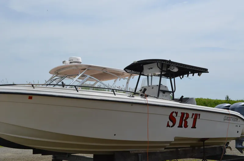 Slide: The Image of 2005 Glasstream 328 SCX boat with dual canopies and visible "SRT" lettering. - 5