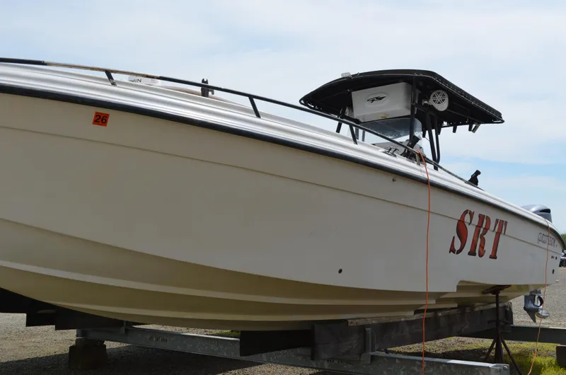 Slide: The Image of 2005 Glasstream 328 SCX boat on trailer, side view with "SRT" lettering. - 6