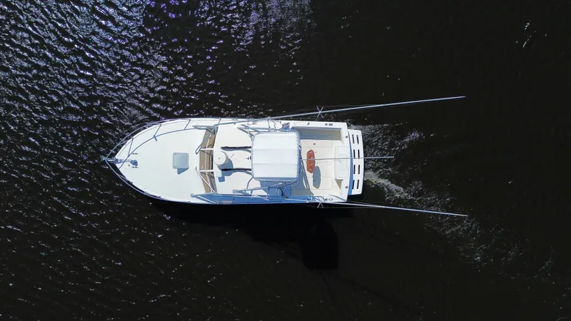Slide: The Image of Aerial view of 2004 Carolina Classic 28 boat on dark water. - 12