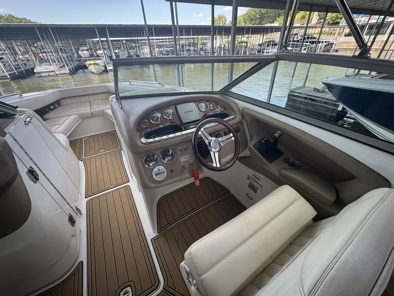 Slide: The Image of Interior of a 2002 Sea Ray 290 boat with steering wheel and dashboard. - 3