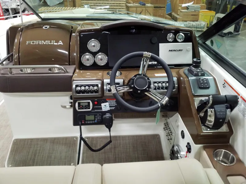 Slide: The Image of 2019 Formula 350 Crossover Bowrider OB dashboard with steering wheel and controls. - 11