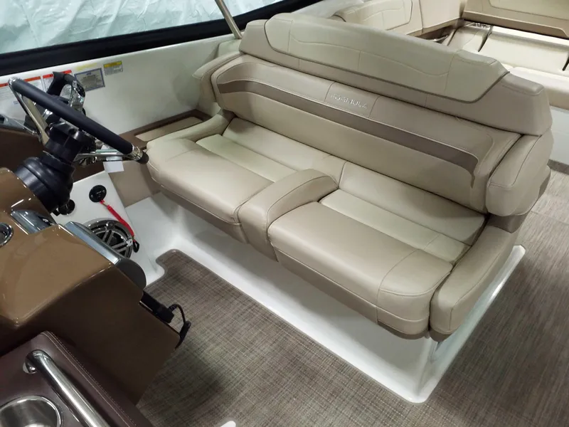 Slide: The Image of 2019 Formula 350 Crossover Bowrider OB interior with beige leather seating and steering wheel. - 12