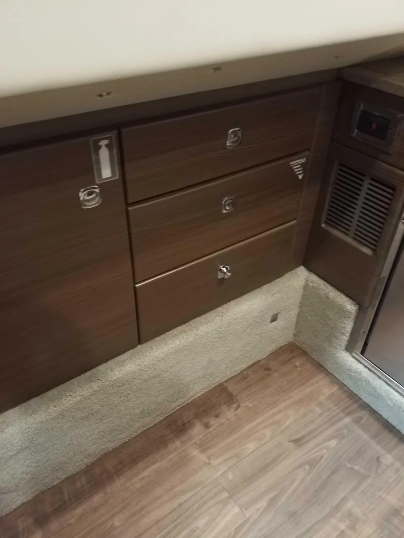 Slide: The Image of Interior cabin storage of 2019 Formula 350 Crossover Bowrider OB boat. - 17