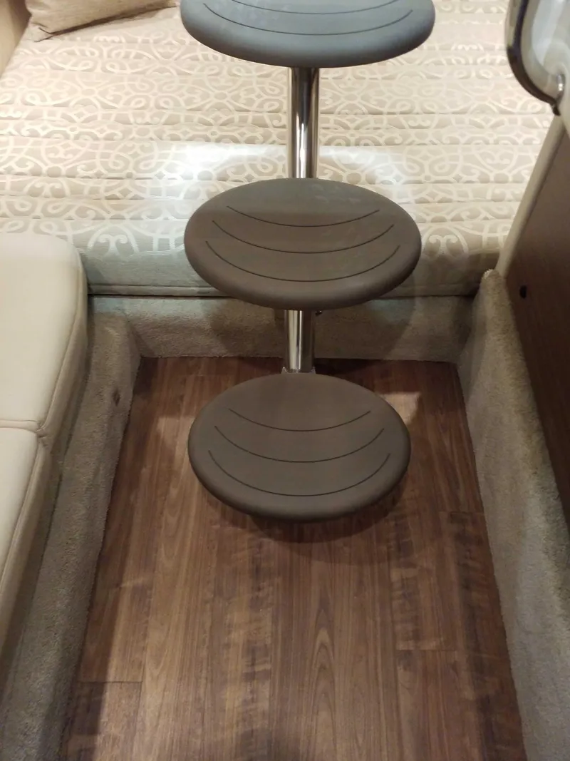 Slide: The Image of Interior of 2019 Formula 350 Crossover Bowrider OB with wooden flooring and circular steps. - 18