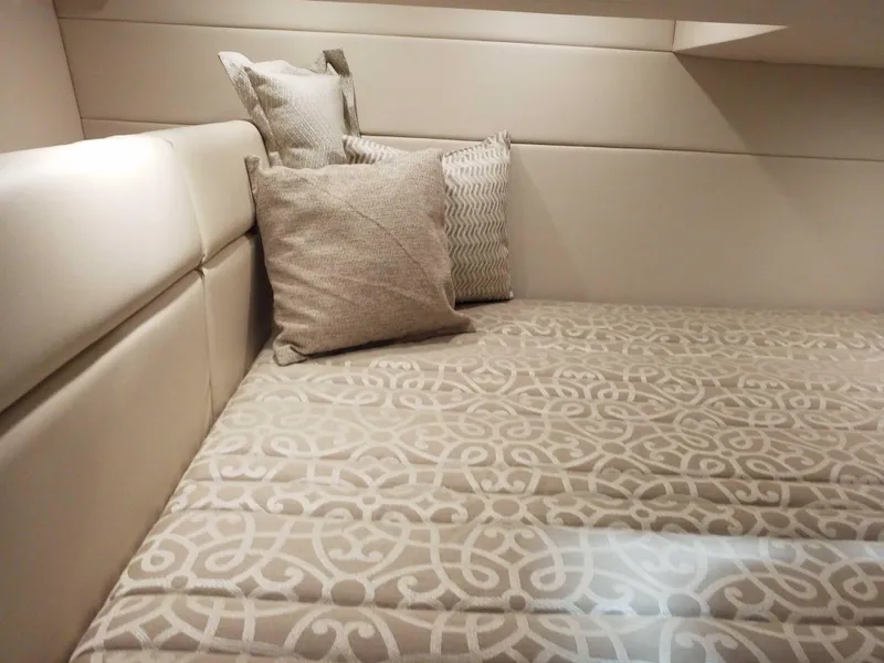 Slide: The Image of 2019 Formula 350 Crossover Bowrider OB cabin with patterned bedding and cushions. - 20