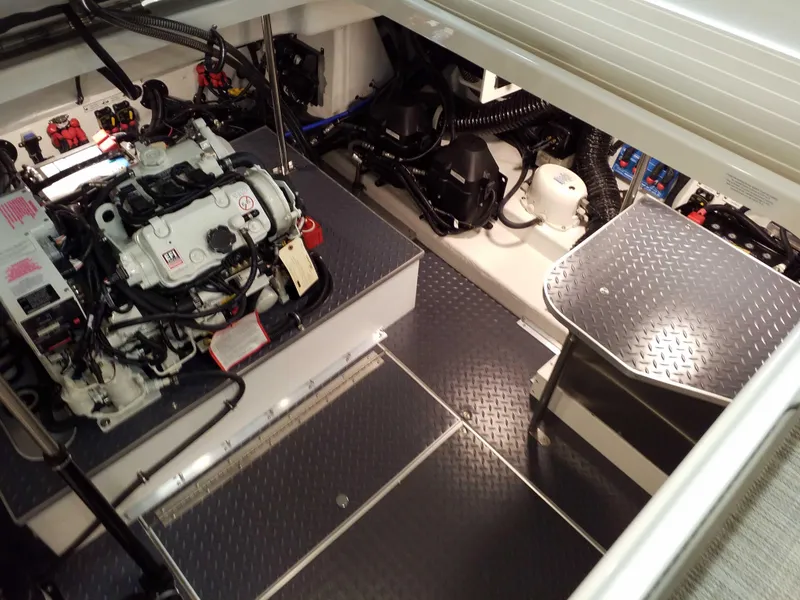 Slide: The Image of Engine compartment of 2019 Formula 350 Crossover Bowrider OB with detailed mechanical components. - 26