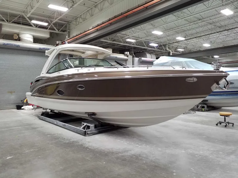 Slide: The Image of 2019 Formula 350 Crossover Bowrider OB in a showroom, side view. - 3