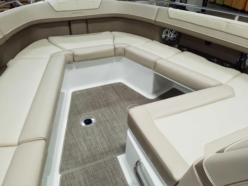 Slide: The Image of 2019 Formula 350 Crossover Bowrider OB interior with beige seating and carpeted flooring. - 31
