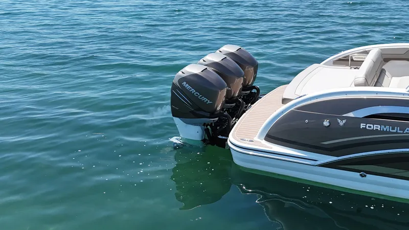 Slide: The Image of 2019 Formula 350 Crossover Bowrider OB with triple Mercury outboard engines on water. - 40