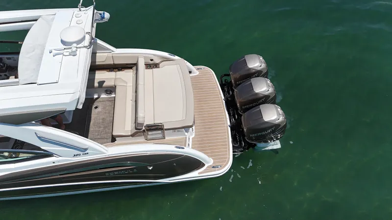 Slide: The Image of 2019 Formula 350 Crossover Bowrider OB with triple Mercury outboard engines on clear water. - 43