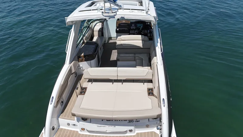 Slide: The Image of 2019 Formula 350 Crossover Bowrider OB on water, showcasing spacious seating and sleek design. - 47