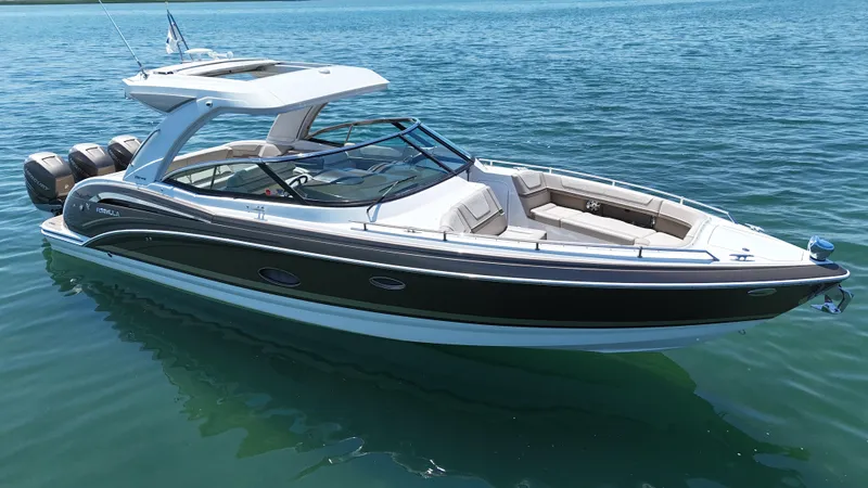 Slide: The Image of 2019 Formula 350 Crossover Bowrider OB on calm blue water. - 49