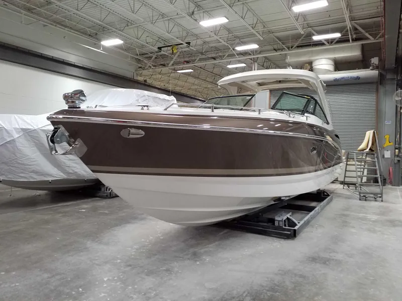 Slide: The Image of 2019 Formula 350 Crossover Bowrider OB in a warehouse setting. - 5