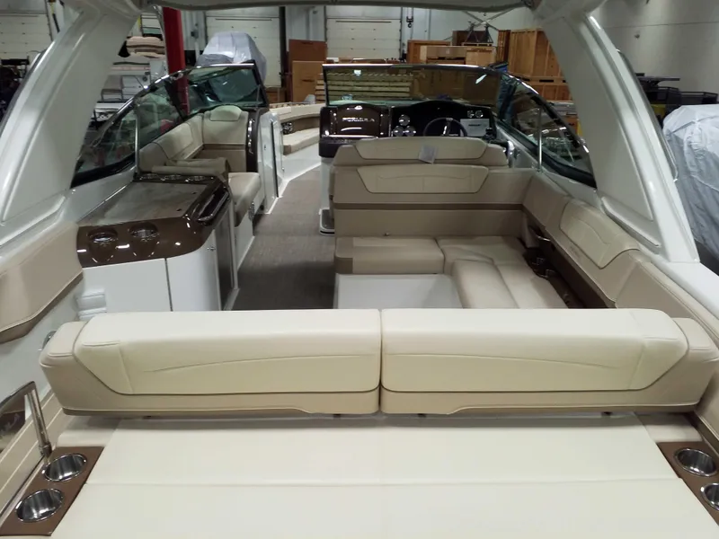 Slide: The Image of 2019 Formula 350 Crossover Bowrider OB interior with beige seating and modern design. - 9