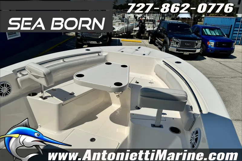 Slide: The Image of 2025 Sea Born LX24 Center Console boat interior with seating and table, displayed at Antonietti Marine. - 10