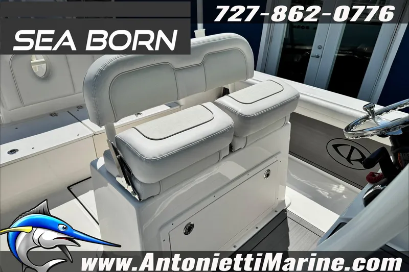 Slide: The Image of 2025 Sea Born LX24 Center Console boat interior with seating and steering wheel. - 12