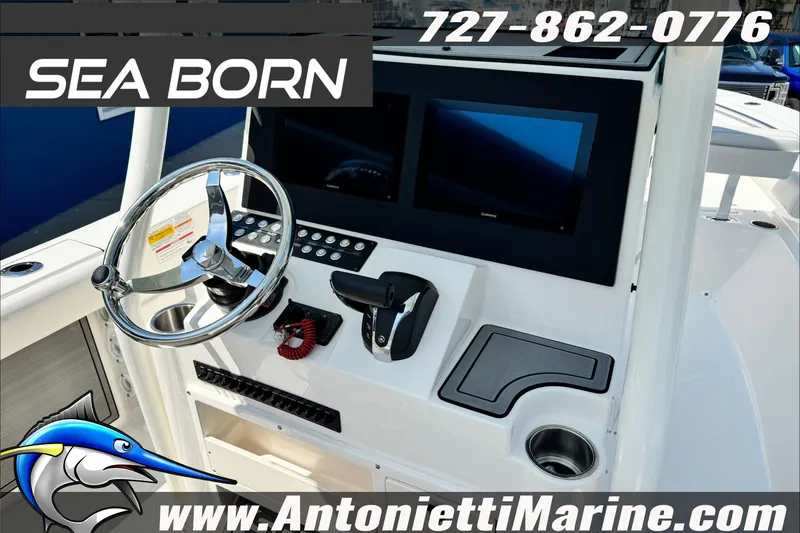 Slide: The Image of 2025 Sea Born LX24 Center Console boat dashboard with dual screens and steering wheel. - 14
