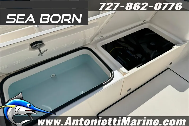 Slide: The Image of 2025 Sea Born LX24 Center Console boat with open storage compartments, displayed by Antonietti Marine. - 28