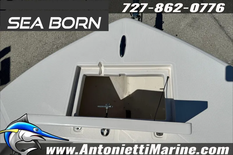 Slide: The Image of 2025 Sea Born LX24 Center Console boat deck with storage compartment open. - 34