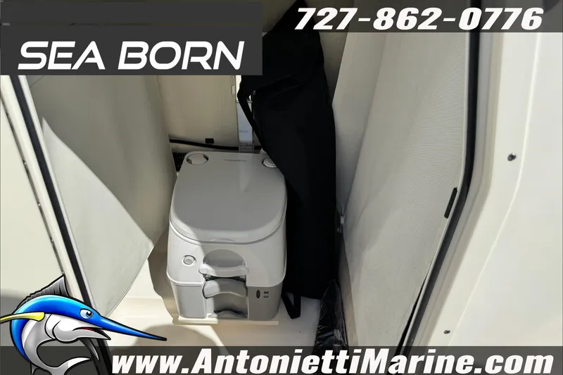 Slide: The Image of 2025 Sea Born LX24 Center Console interior with portable toilet, marine design. - 39