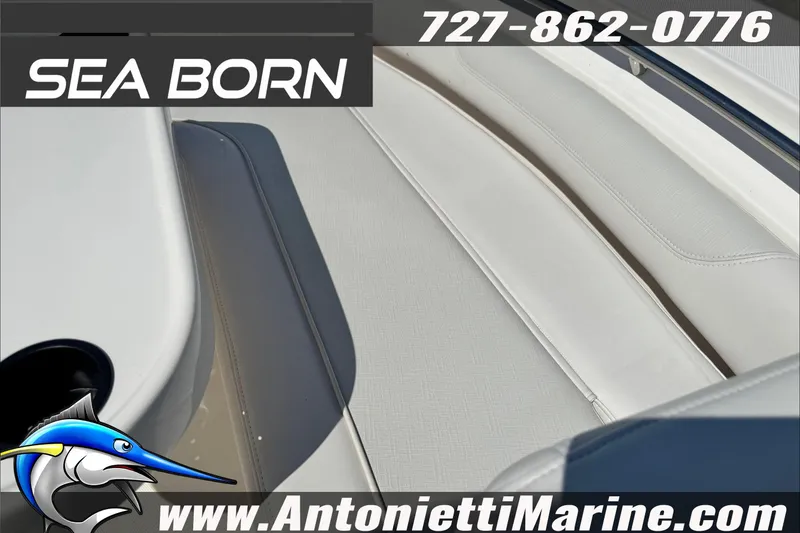 Slide: The Image of 2025 Sea Born LX24 Center Console boat interior with white seating, Antonietti Marine branding. - 40