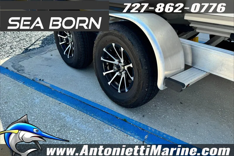 Slide: The Image of 2025 Sea Born LX24 Center Console trailer with black wheels at Antonietti Marine. - 7