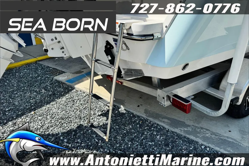 Slide: The Image of 2025 Sea Born LX24 Center Console boat on trailer, featuring a swim ladder. - 9