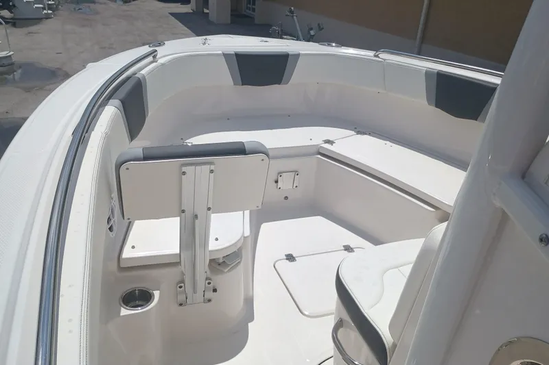 Slide: The Image of 2025 Robalo R230 Center Console boat interior with seating and storage compartments. - 17