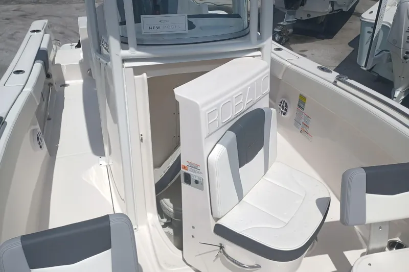 Slide: The Image of 2025 Robalo R230 Center Console boat interior with seating and console details. - 20