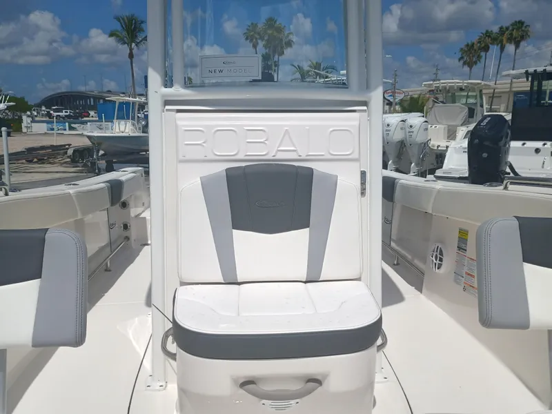 Slide: The Image of 2025 Robalo R230 Center Console boat interior with seating, showcasing modern design and comfort. - 26