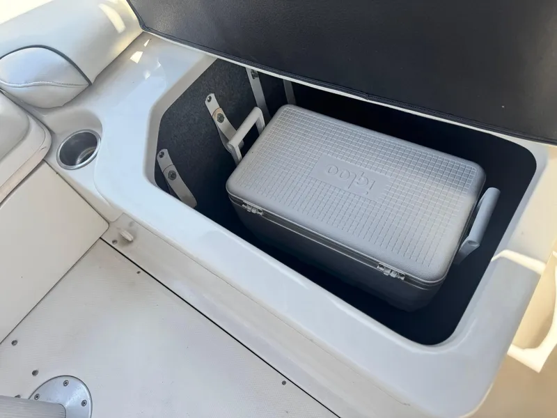 Slide: The Image of Storage compartment with cooler on a 2005 Sea Ray 240 Sundeck boat. - 17
