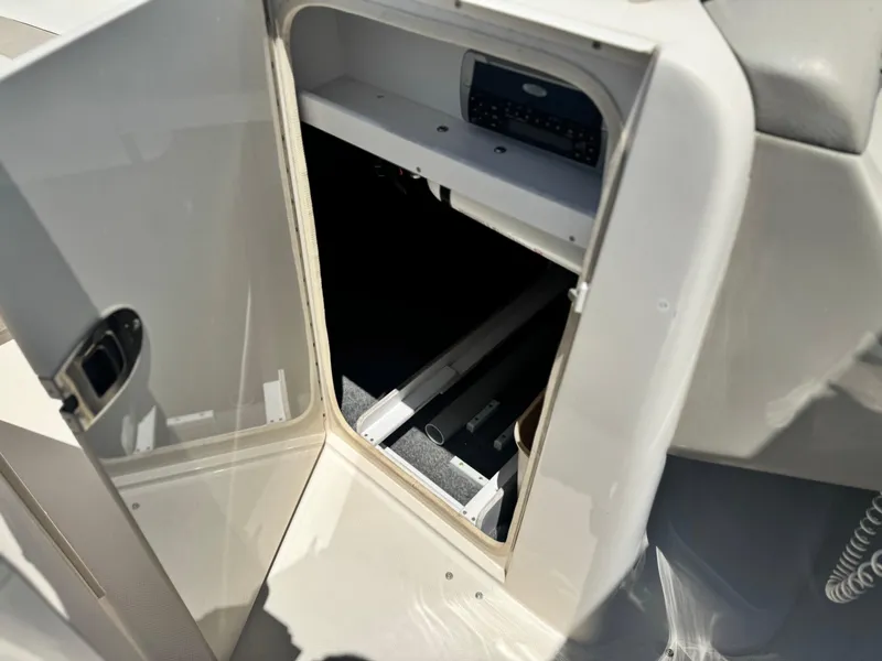 Slide: The Image of Open storage compartment on a 2005 Sea Ray 240 Sundeck boat. - 29