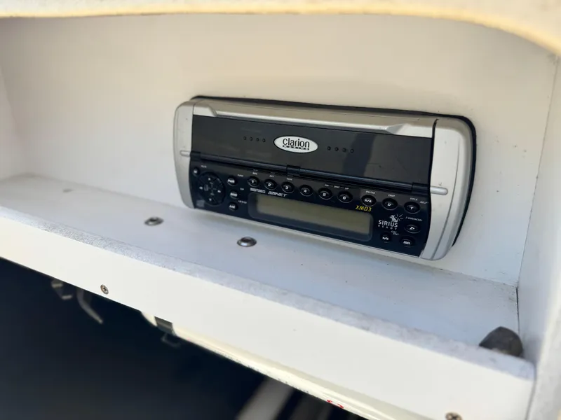 Slide: The Image of Clarion stereo system on 2005 Sea Ray 240 Sundeck boat dashboard. - 30