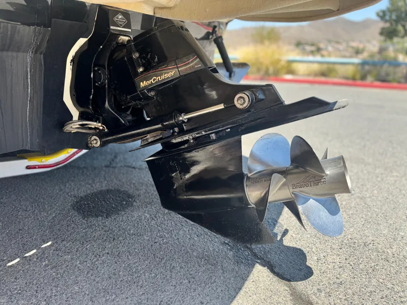 Slide: The Image of MerCruiser Bravo Three outdrive on 2005 Sea Ray 240 Sundeck boat, close-up view. - 7