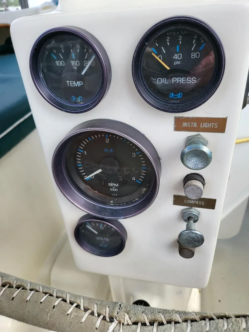 Slide: The Image of Instrument panel of a 1983 Irwin 38 Center Cockpit sailboat, showing gauges and switches. - 10