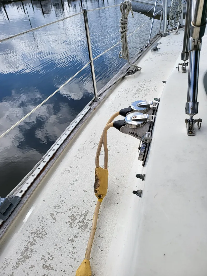 Slide: The Image of Deck of 1983 Irwin 38 Center Cockpit sailboat with winch and rope. - 21