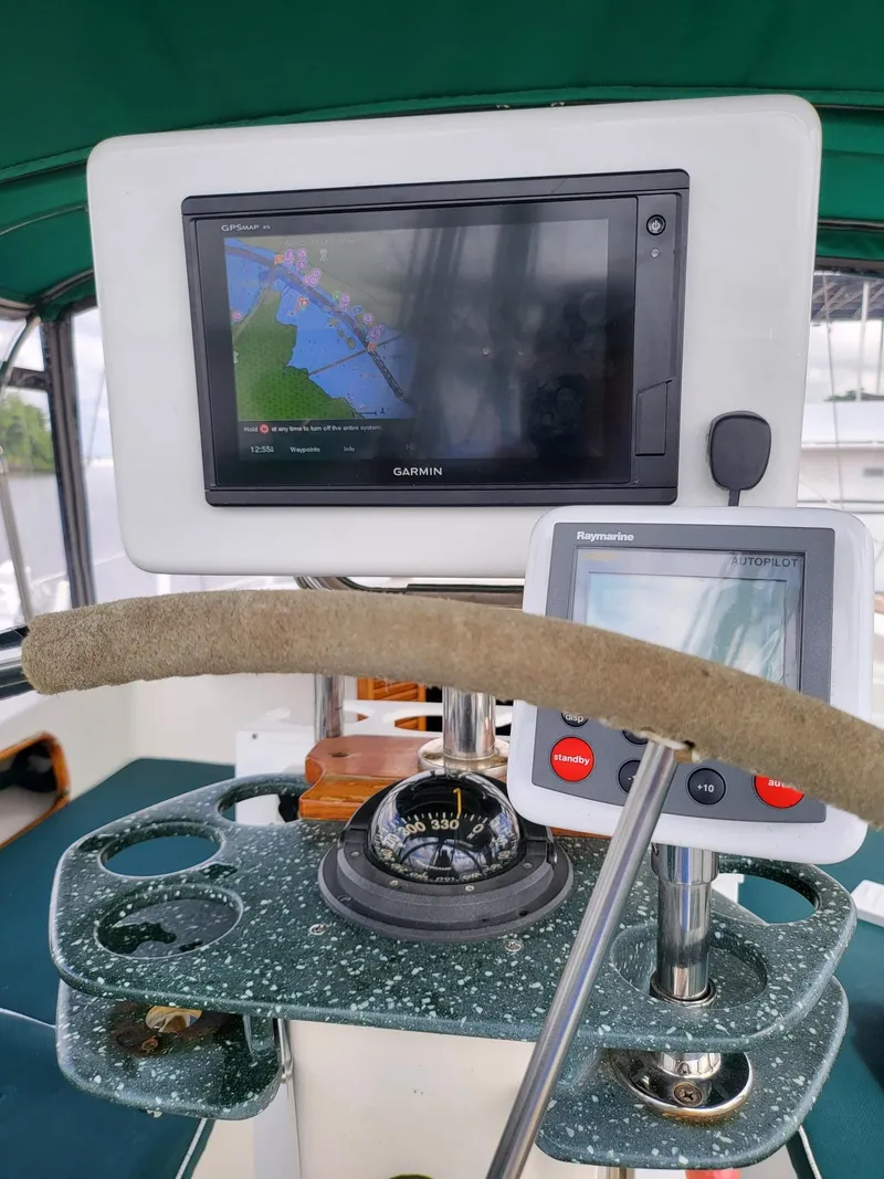 Slide: The Image of Cockpit of 1983 Irwin 38 Center Cockpit with Garmin navigation and Raymarine autopilot systems. - 9