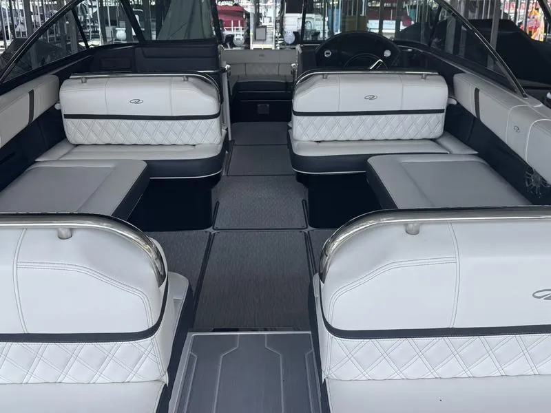 Slide: The Image of Interior of a 2019 Regal 2800 boat with luxurious white seating. - 4