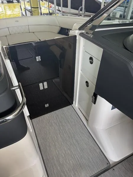 Slide: The Image of 2019 Regal 2800 boat interior with seating and storage compartments. - 7