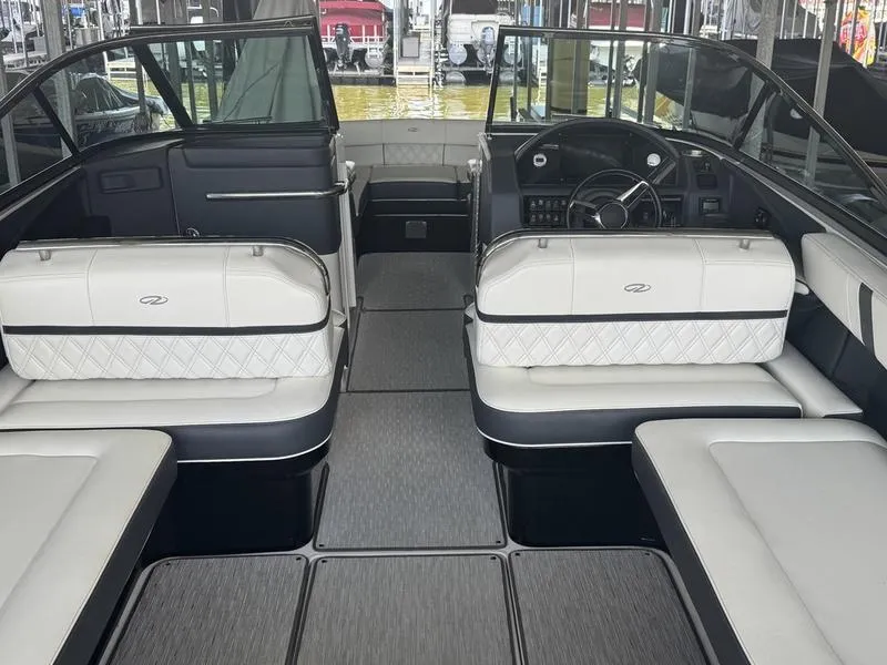 Slide: The Image of 2019 Regal 2800 boat interior with white seating and sleek design. - 9